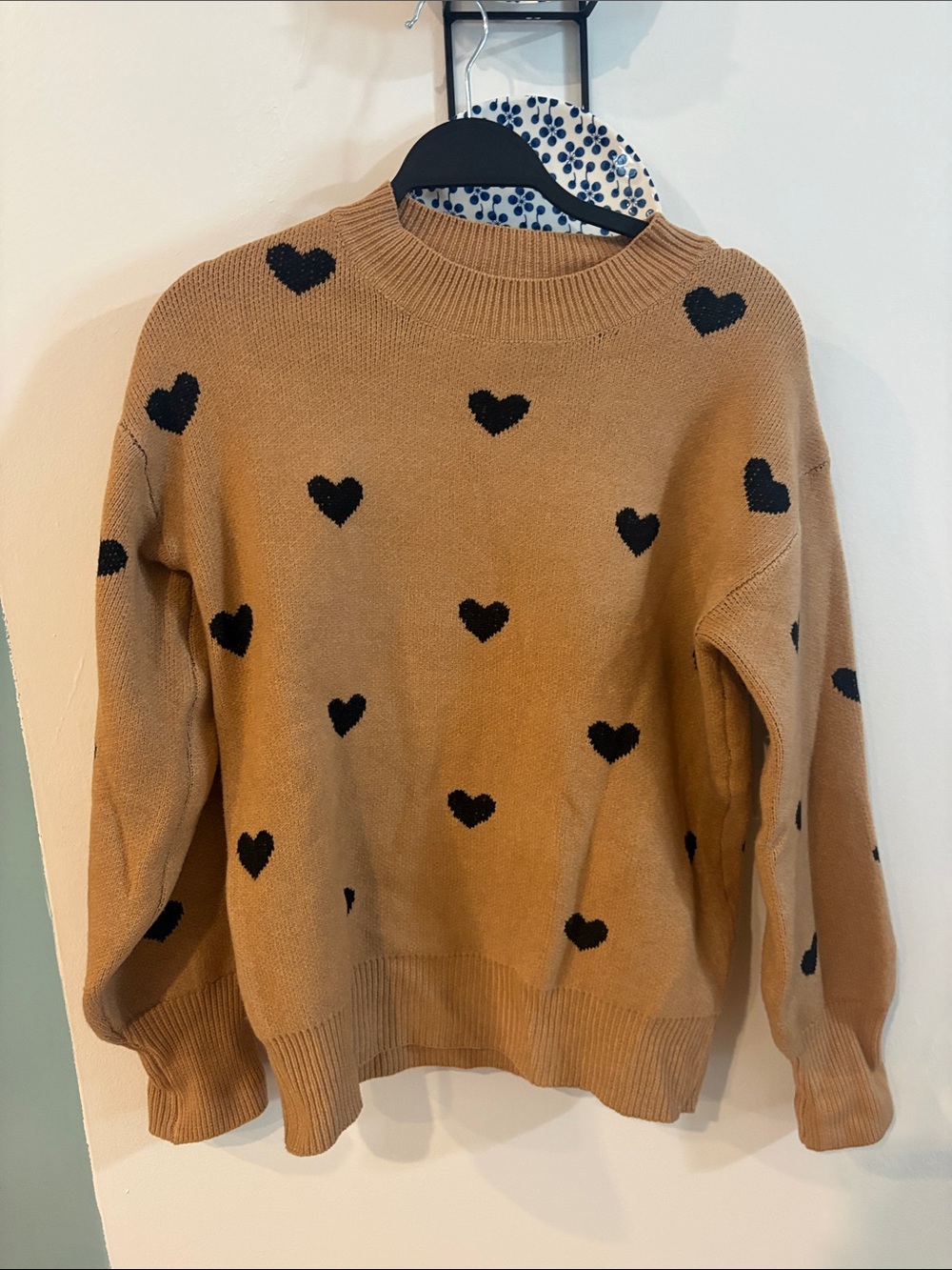 NWOT tan sweater with black heart print